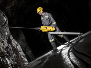 With the Atlas Copco RockDrill 100, RD100 and it´s power unit PP100, a constructor works in a tunnel 450 meters under sea level.